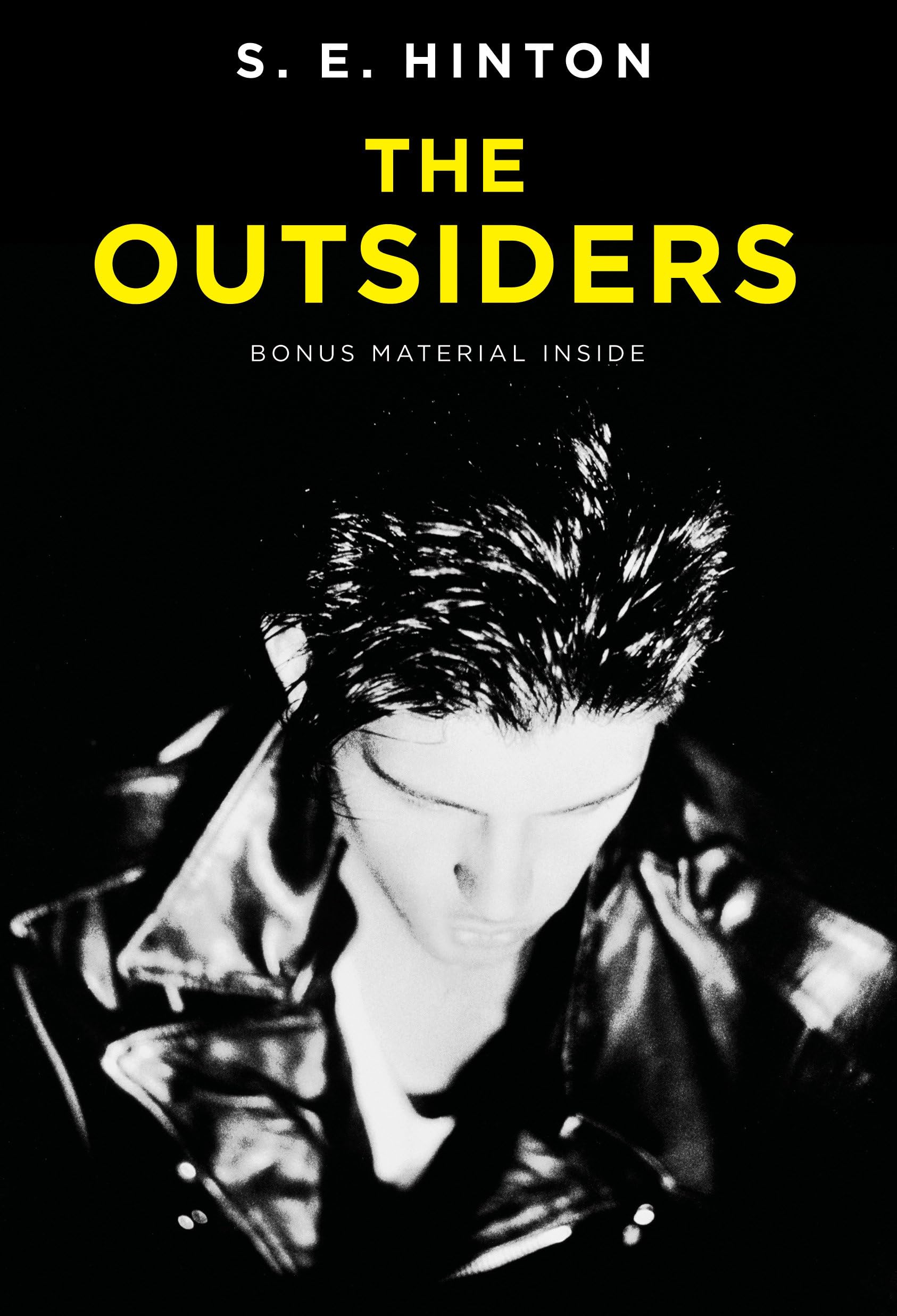 An image of the book cover for The Outsiders, featuring one of the greasers.